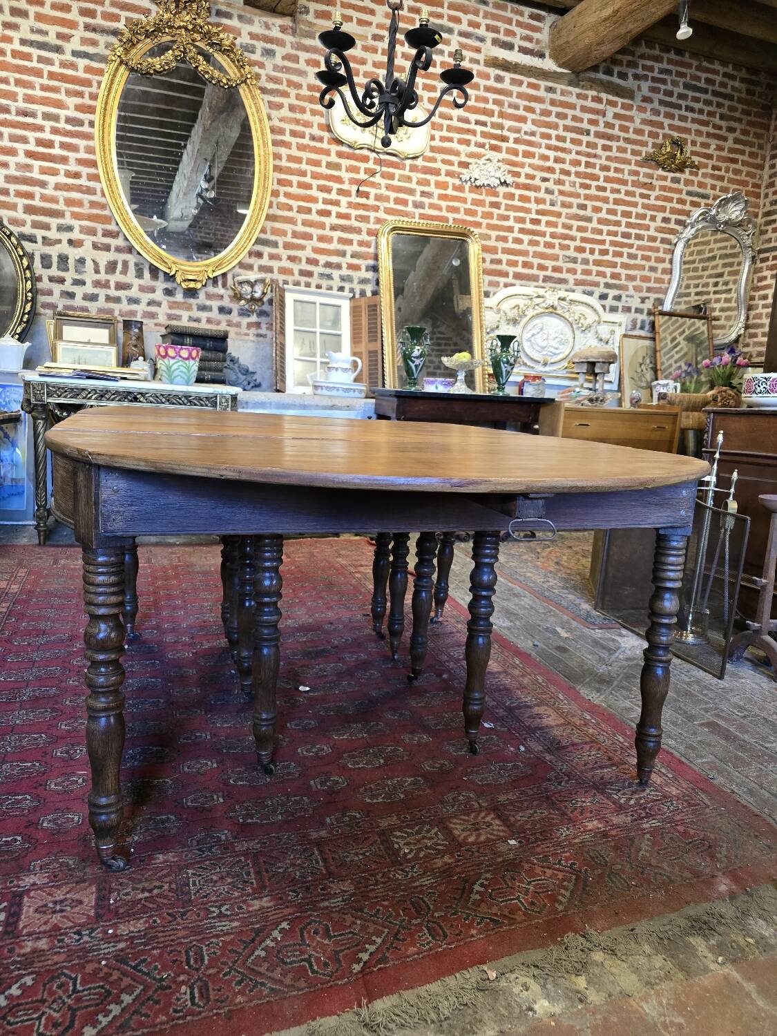 12-foot round oak table with 7 extensions / 20 people