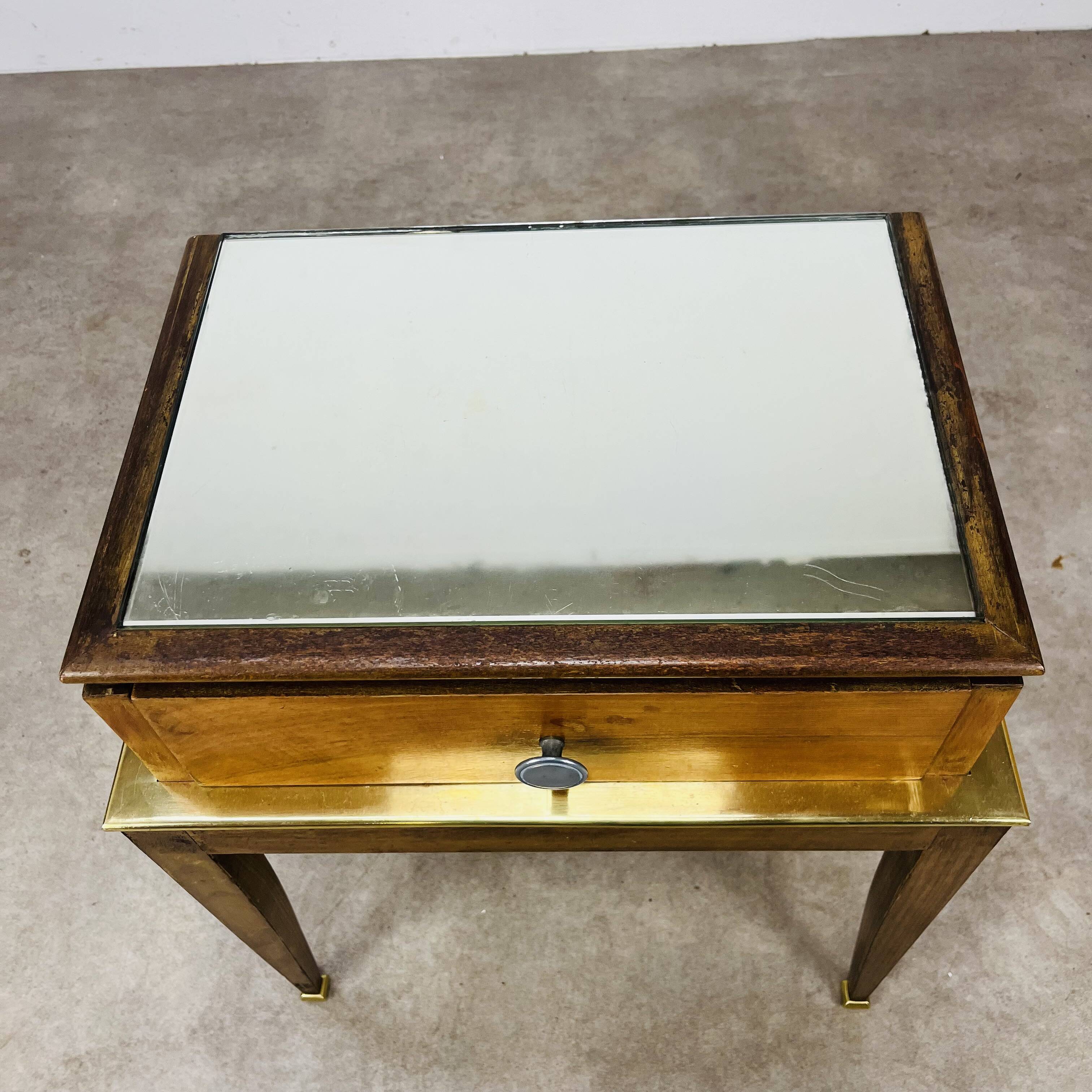 Art Deco mirror and brass bedside table