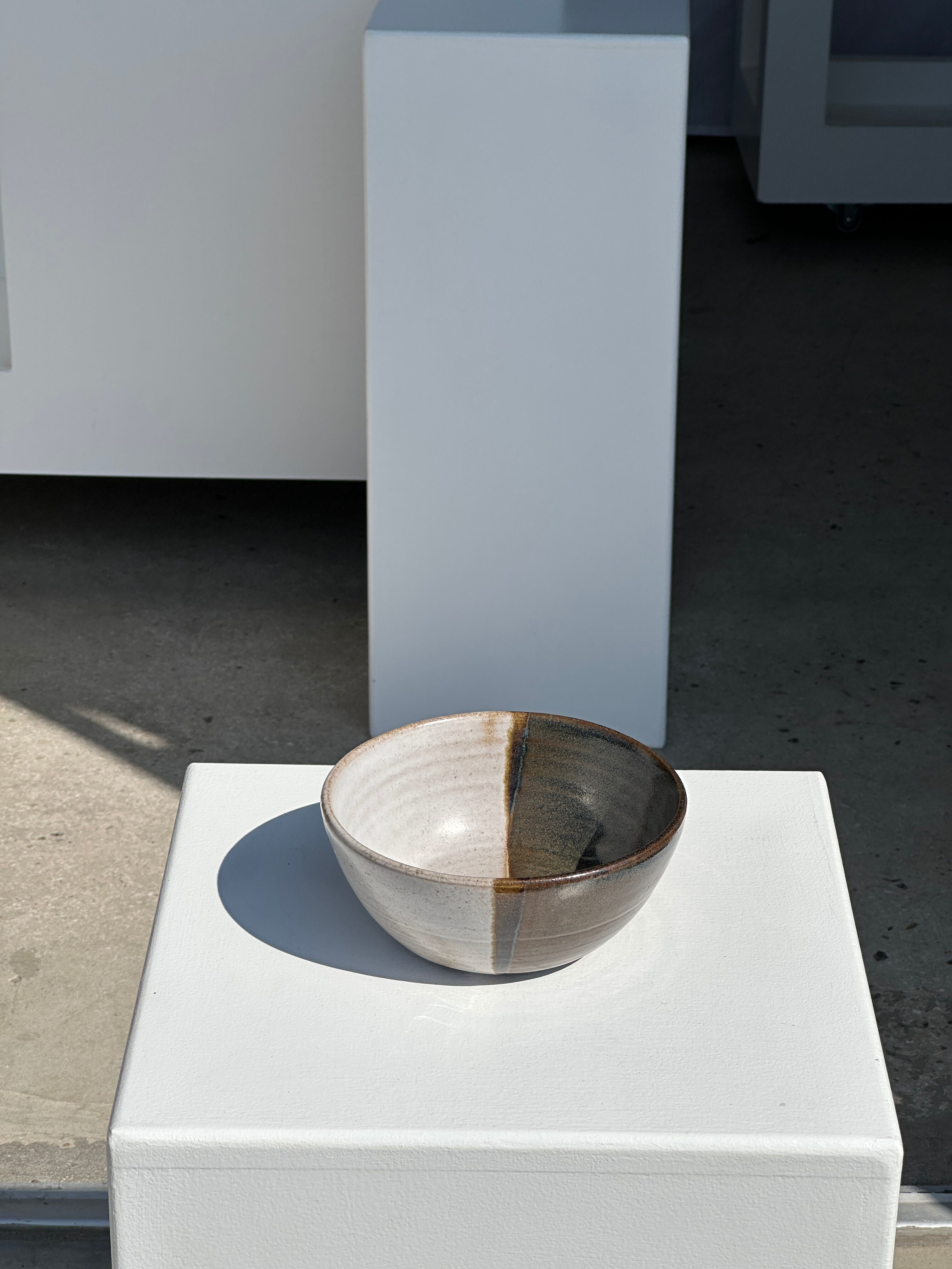 White and glossy brown two-tone ceramic bowl, matt earth