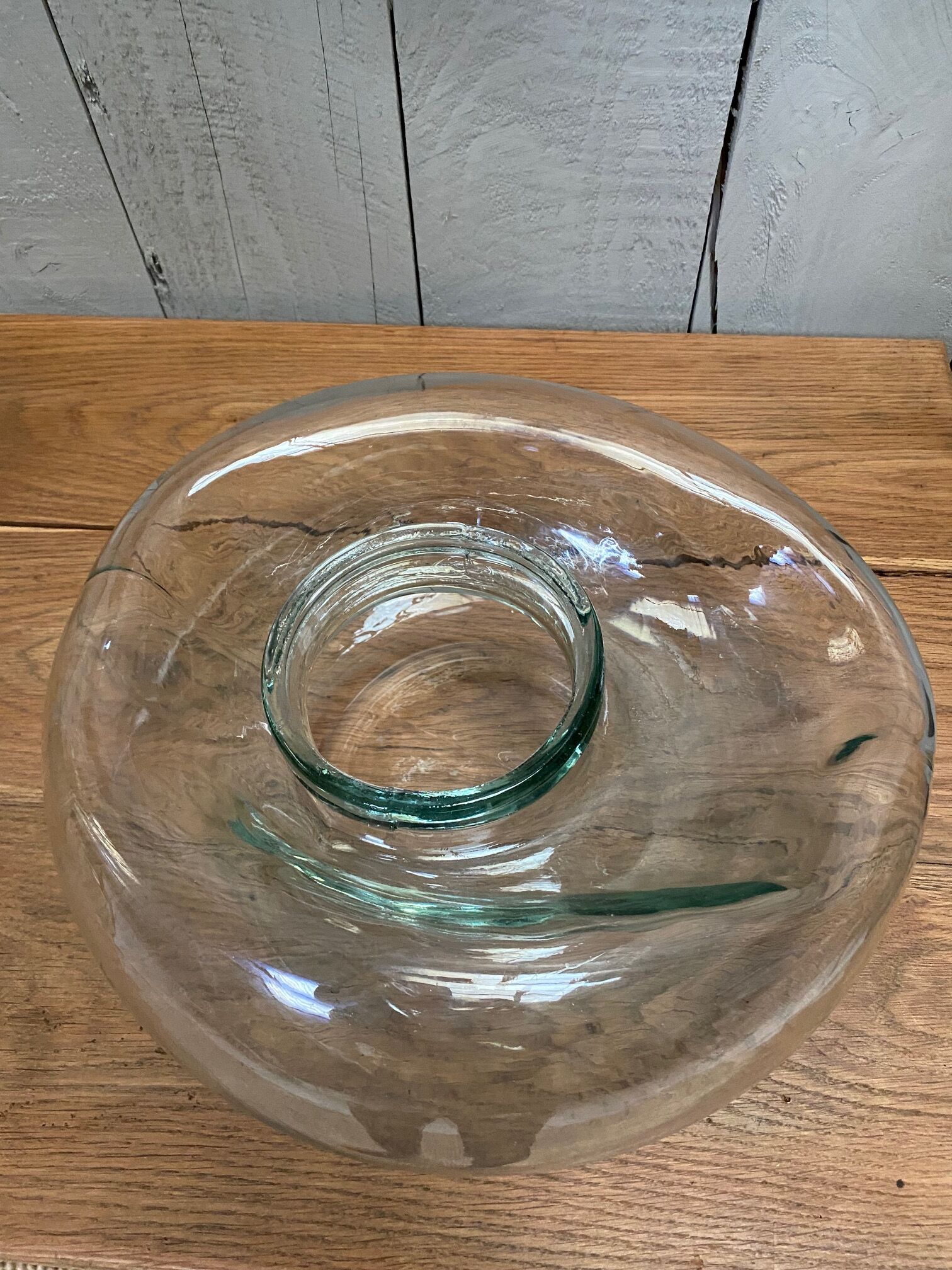 Old jar made of deformed glass