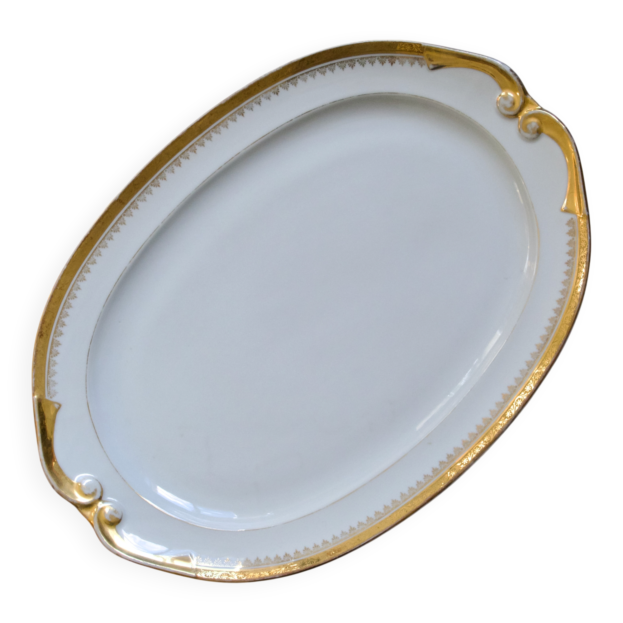 Very large oval dish with gold trim in Limoges porcelain by Peconnet.