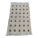 White and black carpet with berber patterns hand-woven in natural wool
