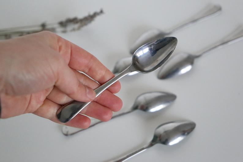 Serving small notched spoons for grapefruit