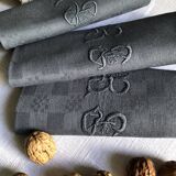 Suite of four napkins tinted in smoke grey
