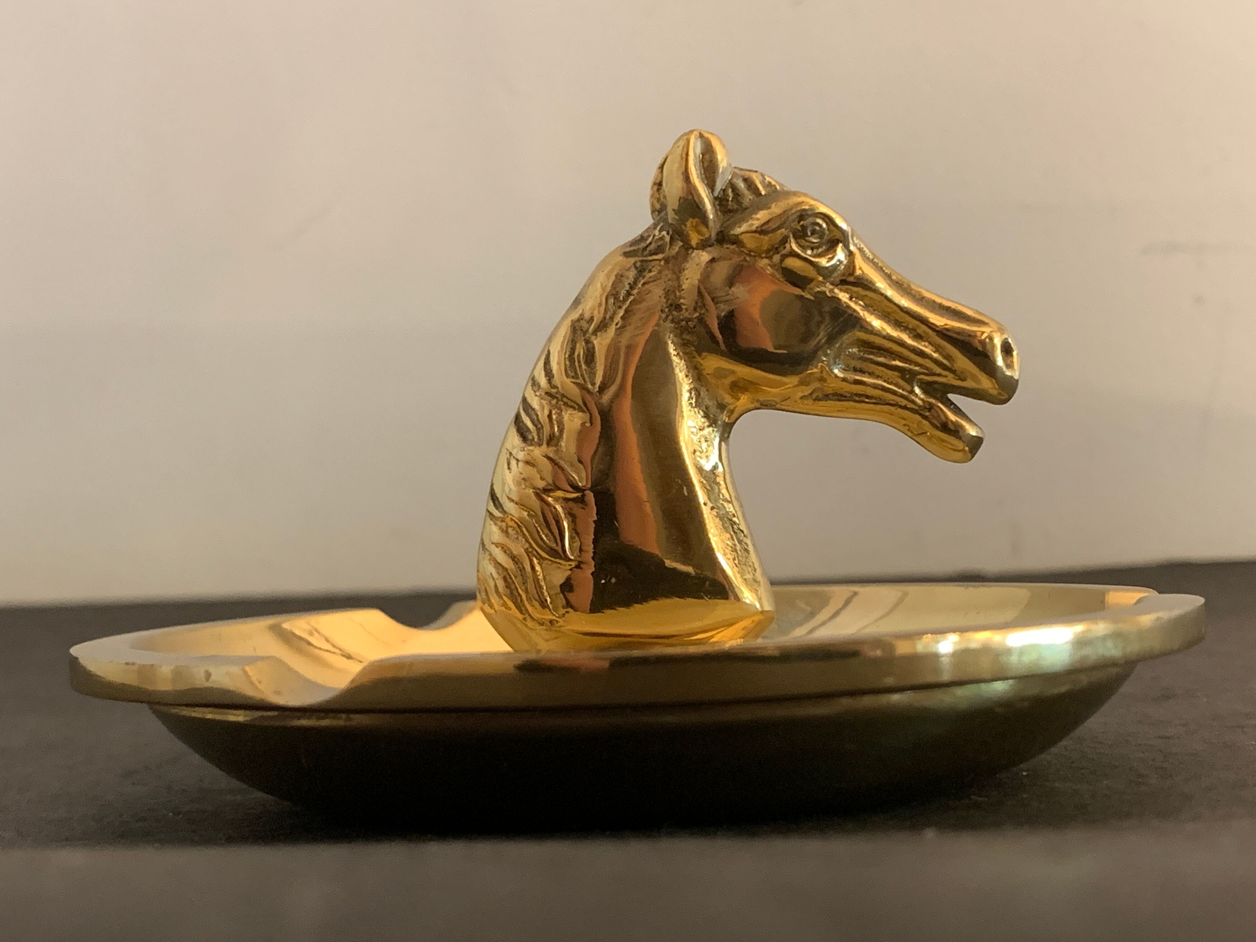 Horse-headed brass ashtray