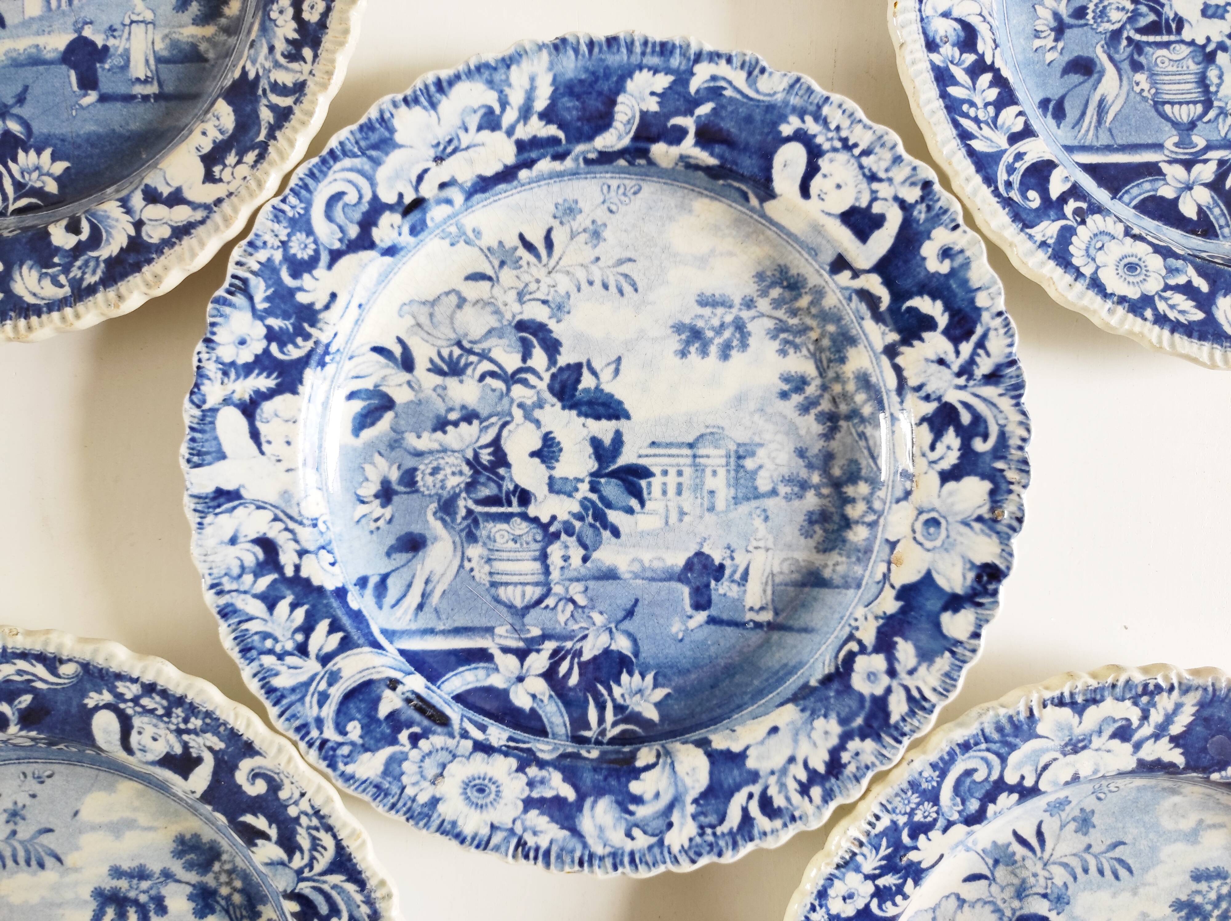 Five 19th century Calais earthenware plates with a romantic gallant couple decor