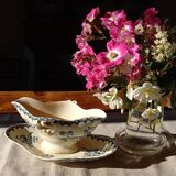 Old gravy boat on frame in terre de fer earthenware by gien, “chardons” model in blue-green