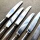 6 dessert knives by Christofle in silver-plated metal, shell decoration.