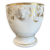 Ceramic pot with antique heads