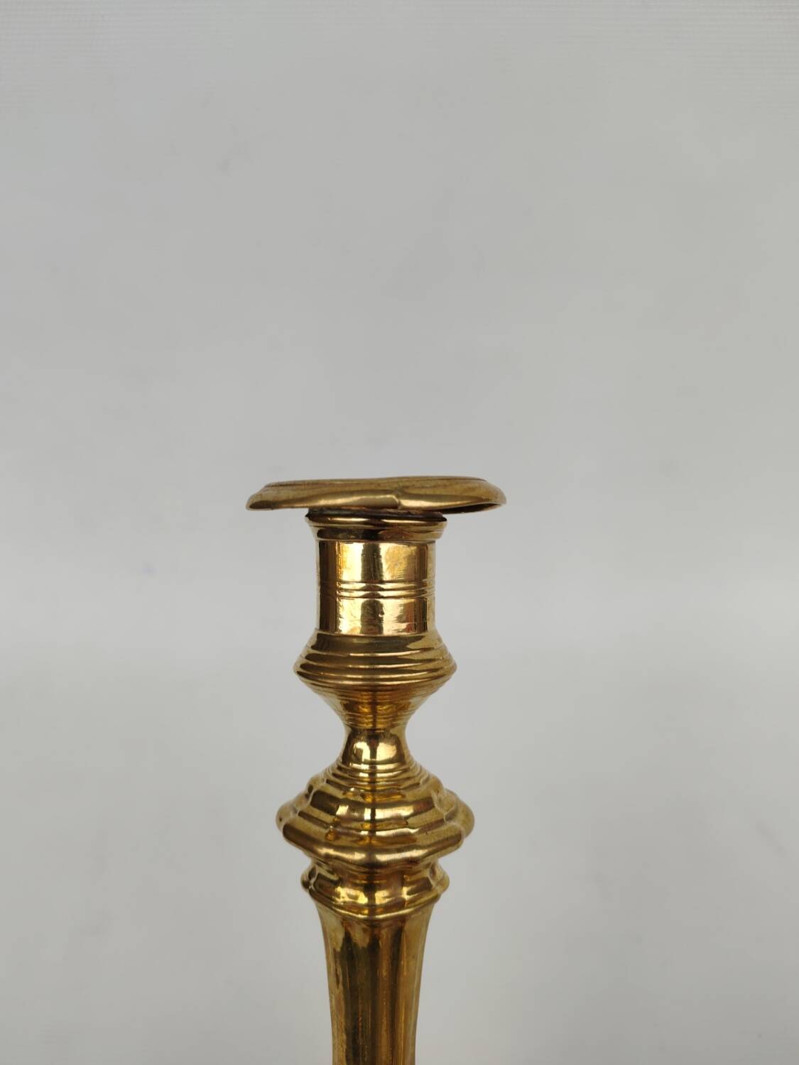 Pair of solid brass candlesticks, early 18th century.