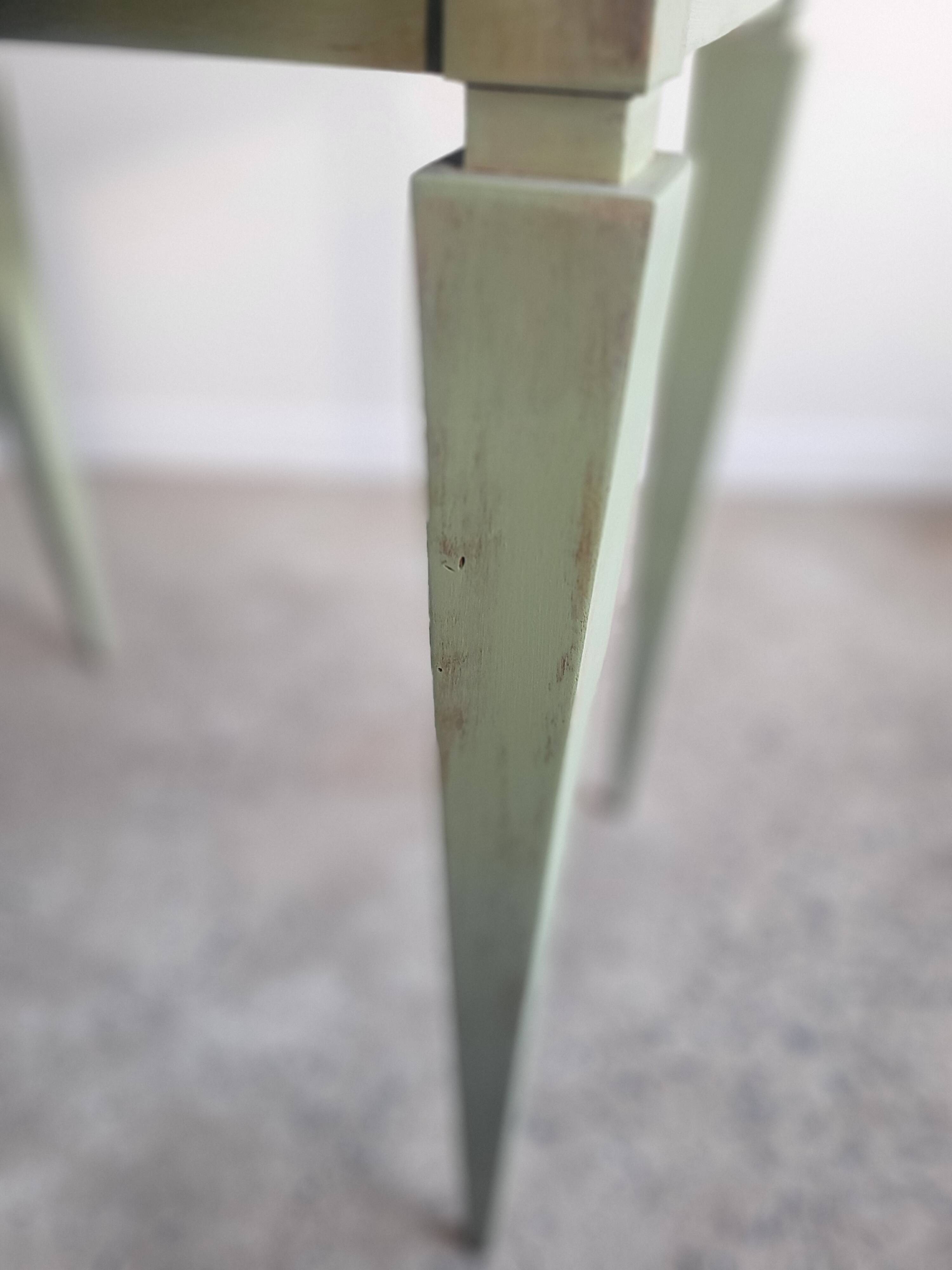 Green side table with tapered legs