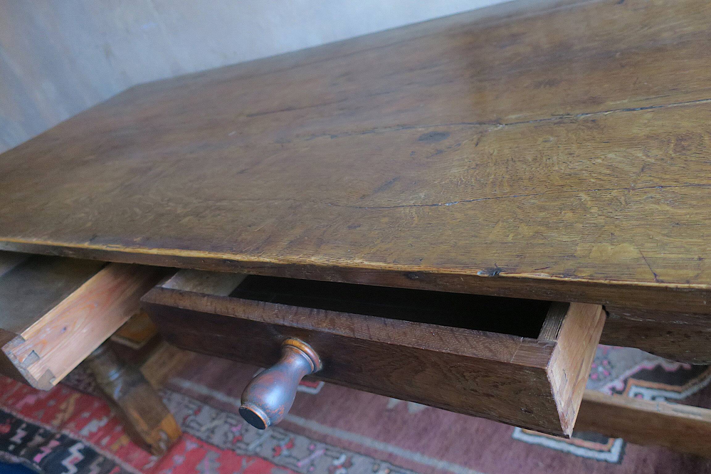 Antique patinated oak dining table, 18th century