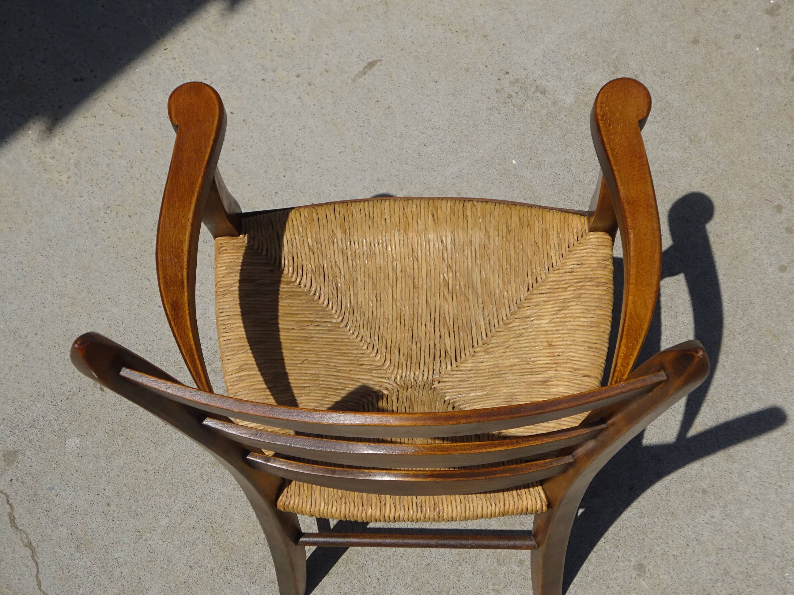 solid wood armchair, straw-covered seat