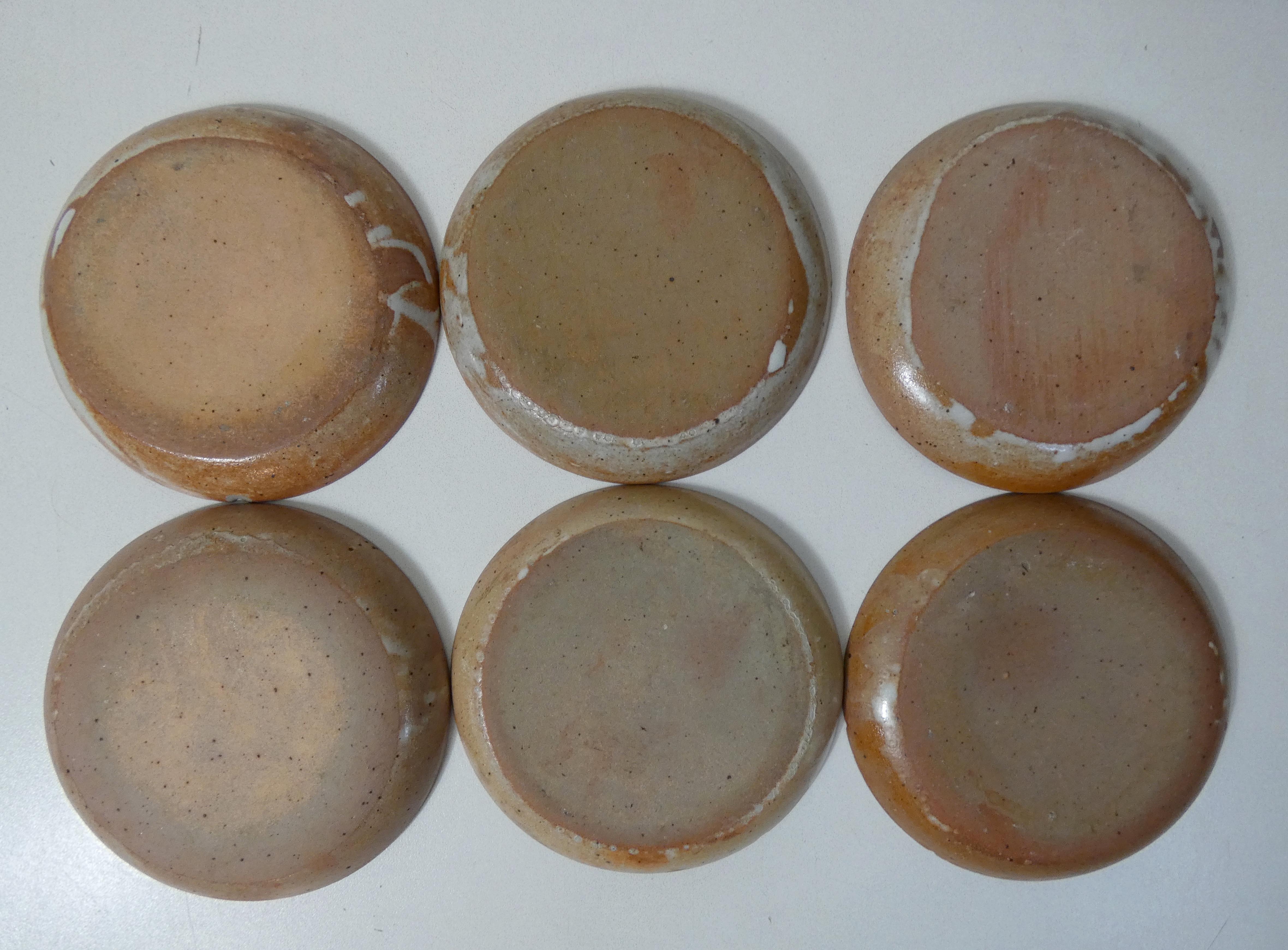 6 stoneware cups and saucers