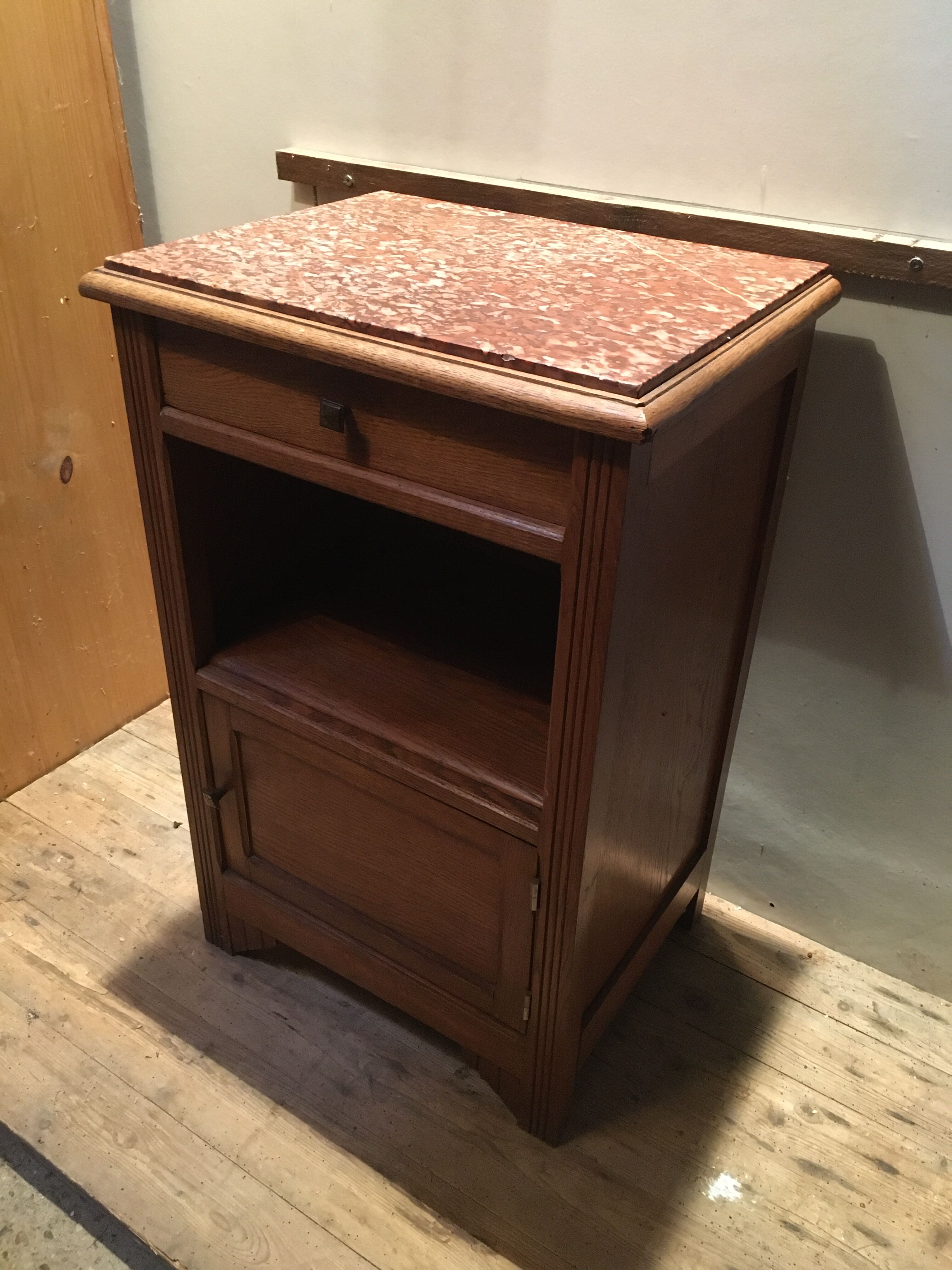 Solid oak bedside table with brown marble.