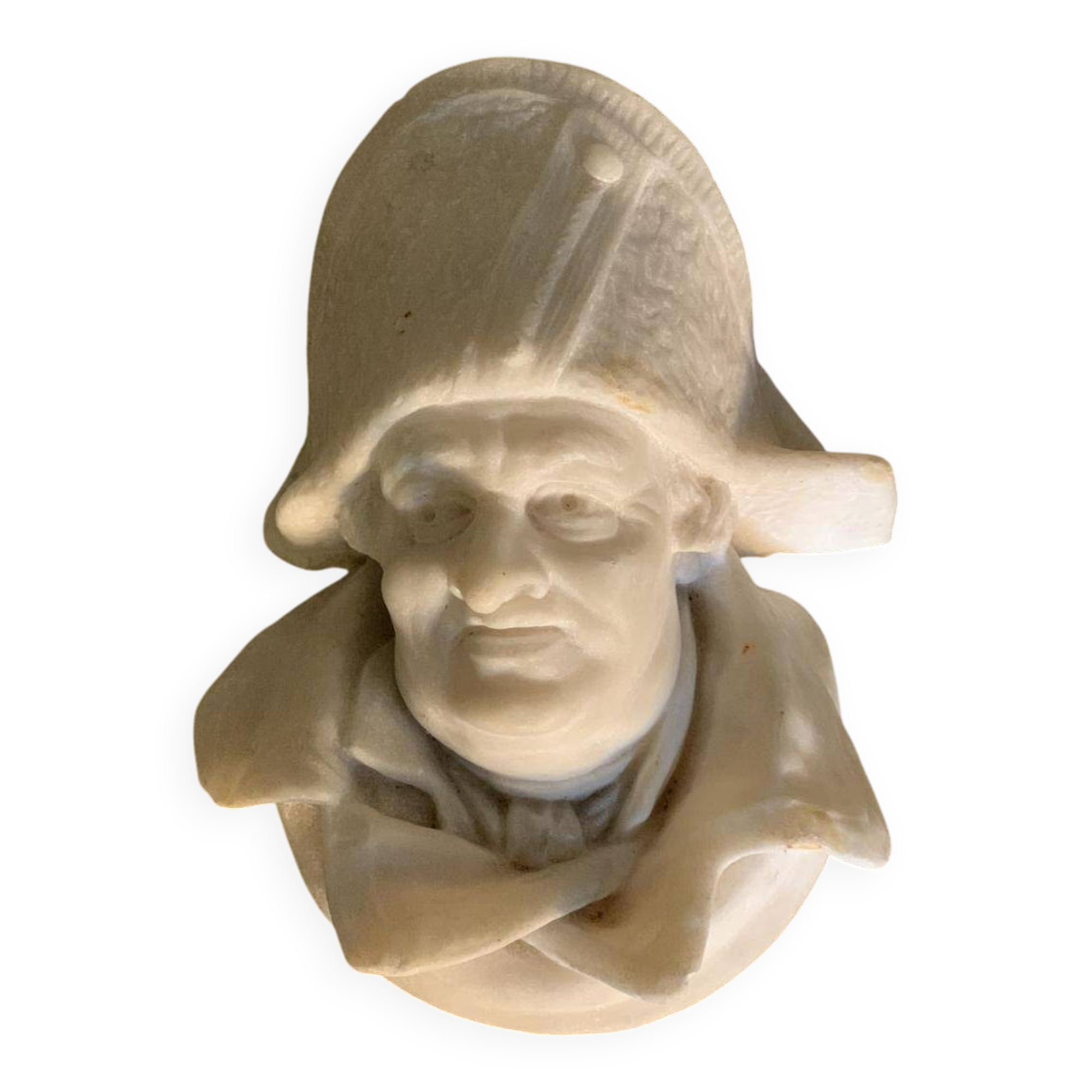 Marble sculpture, man's head in a hat.