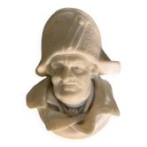 Marble sculpture, man's head in a hat.