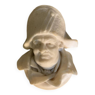 Marble sculpture, man's head in a hat.