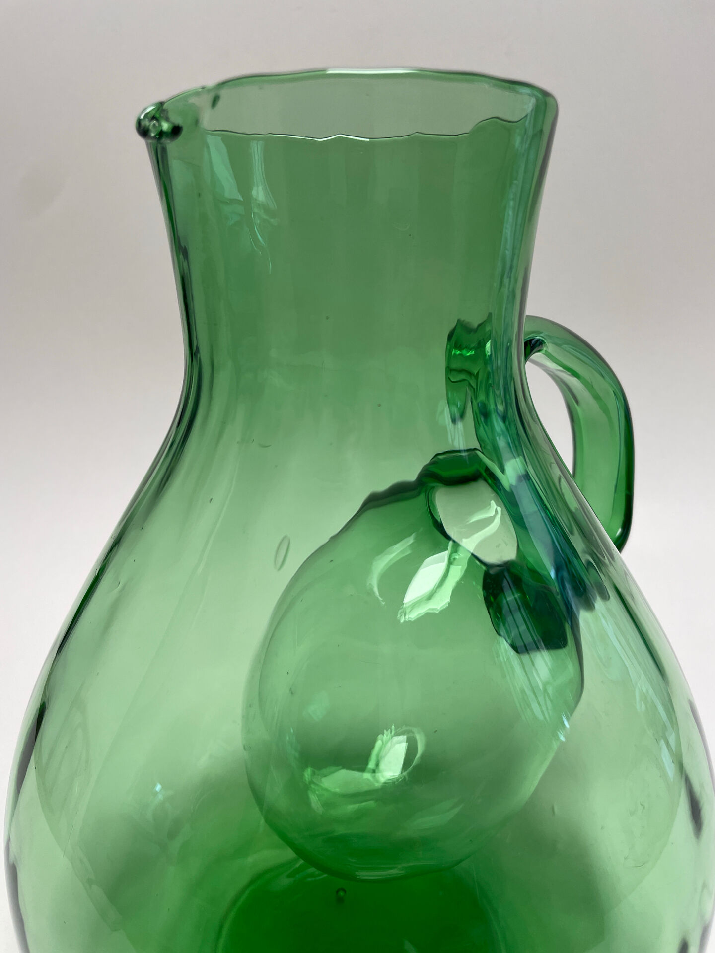 Large green glass cooling jug