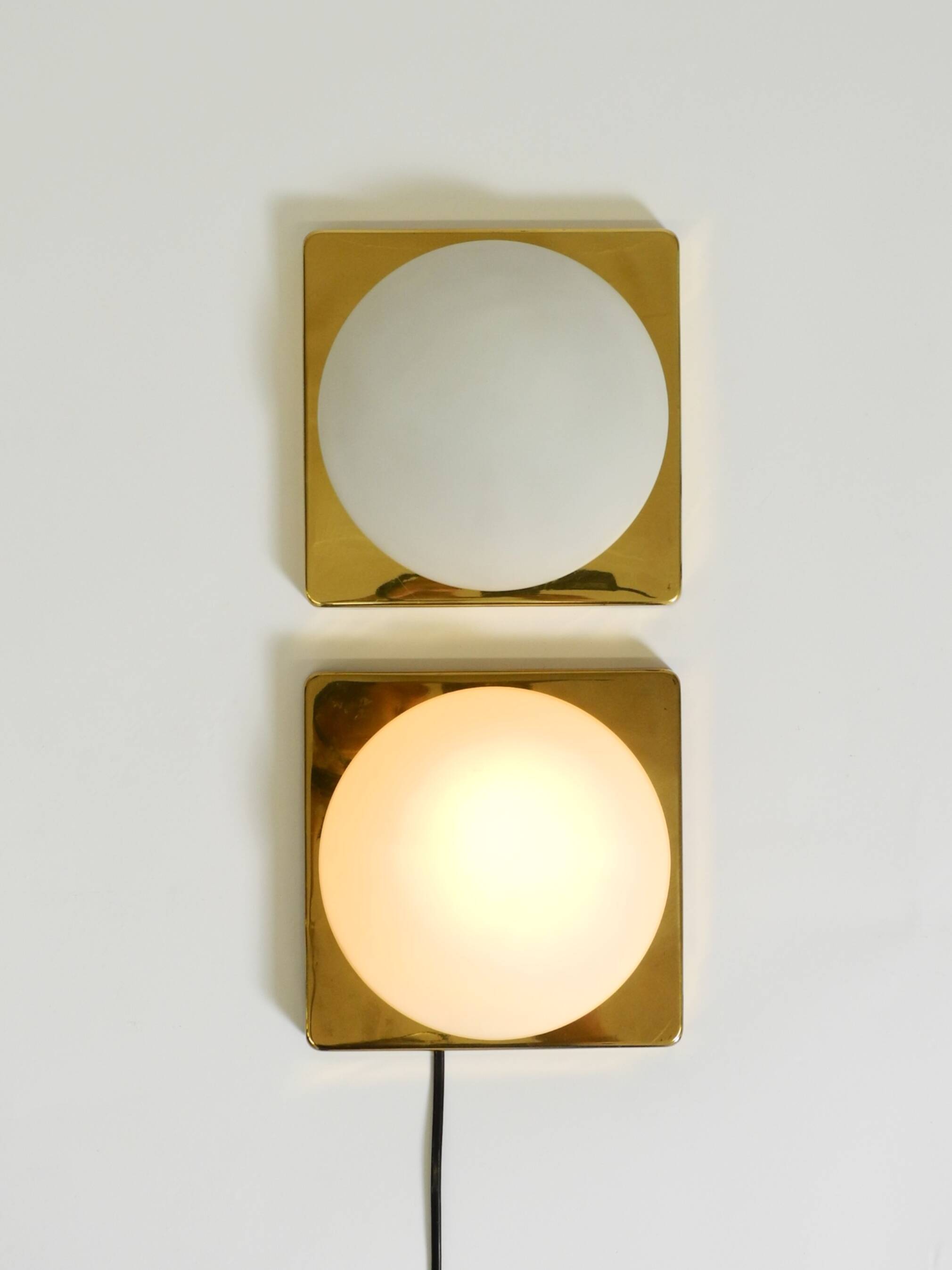 Two 1970s brass wall lamps by Rolf Krüger for Heinz Neuhaus Leuchten