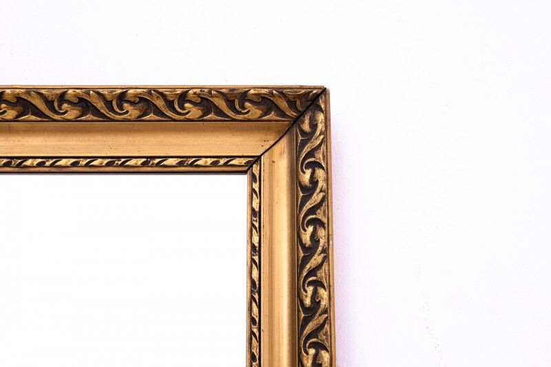 Mirror with a gold frame from the 1950s, France.