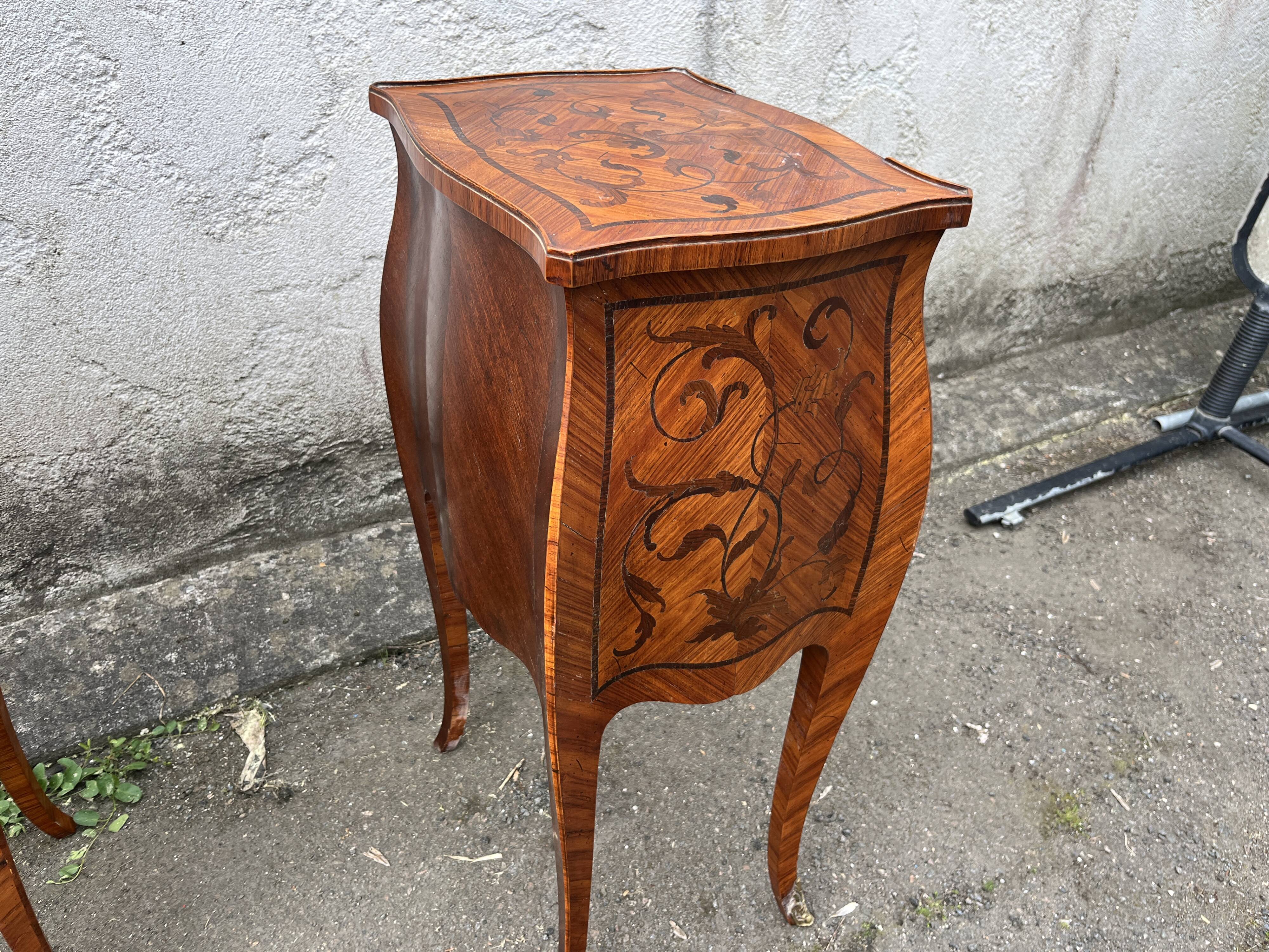 Pair of bedside tables with bombé shape, marquetry, and bronze in Louis XV style.