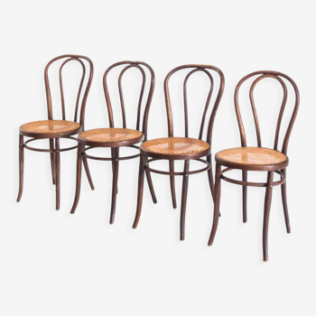 Ensemble de 4 chaises en bois courbé et cannage. Vintage. France, années 50