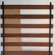 Vintage teak wall coat rack with 5 hooks and mirror.