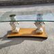 Italian coffee table with glass top, wooden base, and porcelain legs