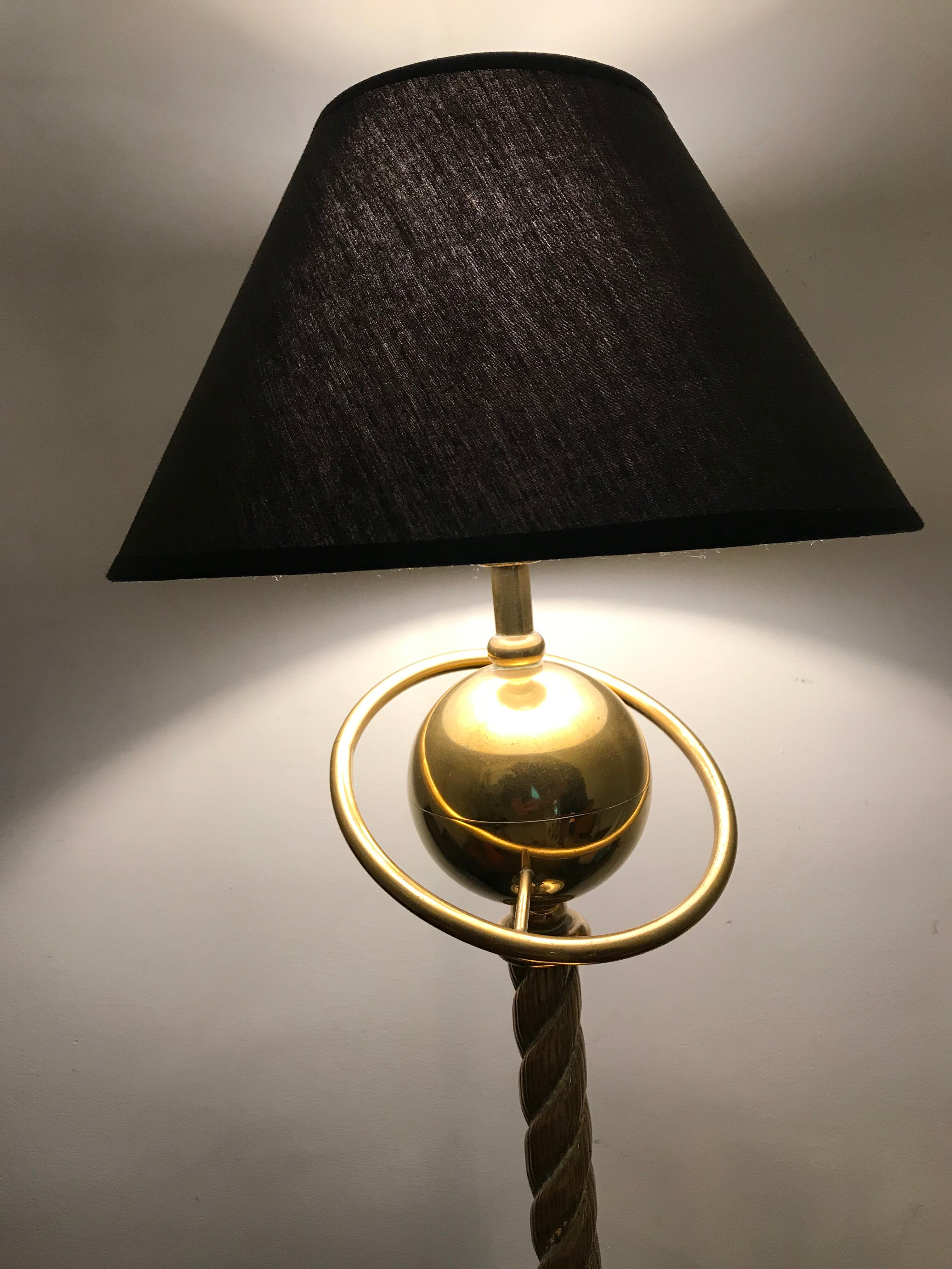 Brass lamp with removable ring around a globe