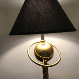 Brass lamp with removable ring around a globe