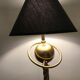 Brass lamp with removable ring around a globe