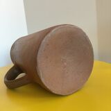 Pitcher in brown sandstone