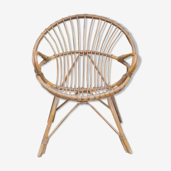 Old rattan basket armchair