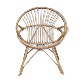 Old rattan basket armchair