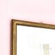 Rectangular gold mirror with bevelled glass.