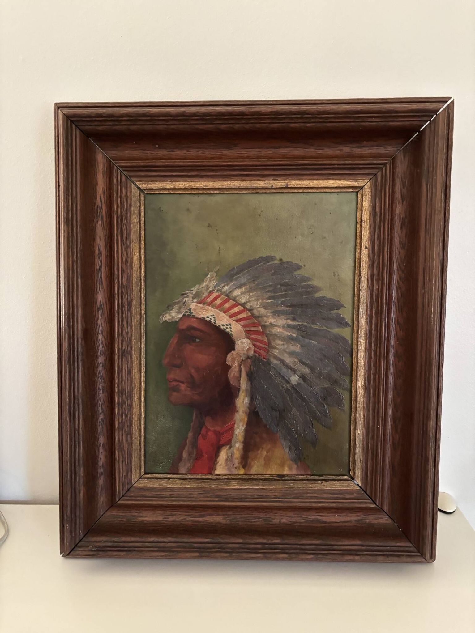 Old oil painting on panel of a Native American chief from the 19th century Wild West.