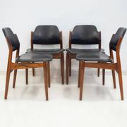 Set of four Arne Vodder chairs in hardwood and black leather.