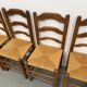 Set of 8 chairs in solid elm with straw seats.