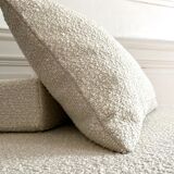 Square ottoman and its cushions in buckle fabric