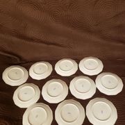 11 porcelain plates 12 sides bordered small flowers