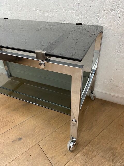 Vintage coffee table on chrome wheel and smoked glass