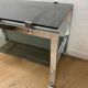 Vintage coffee table on chrome wheel and smoked glass