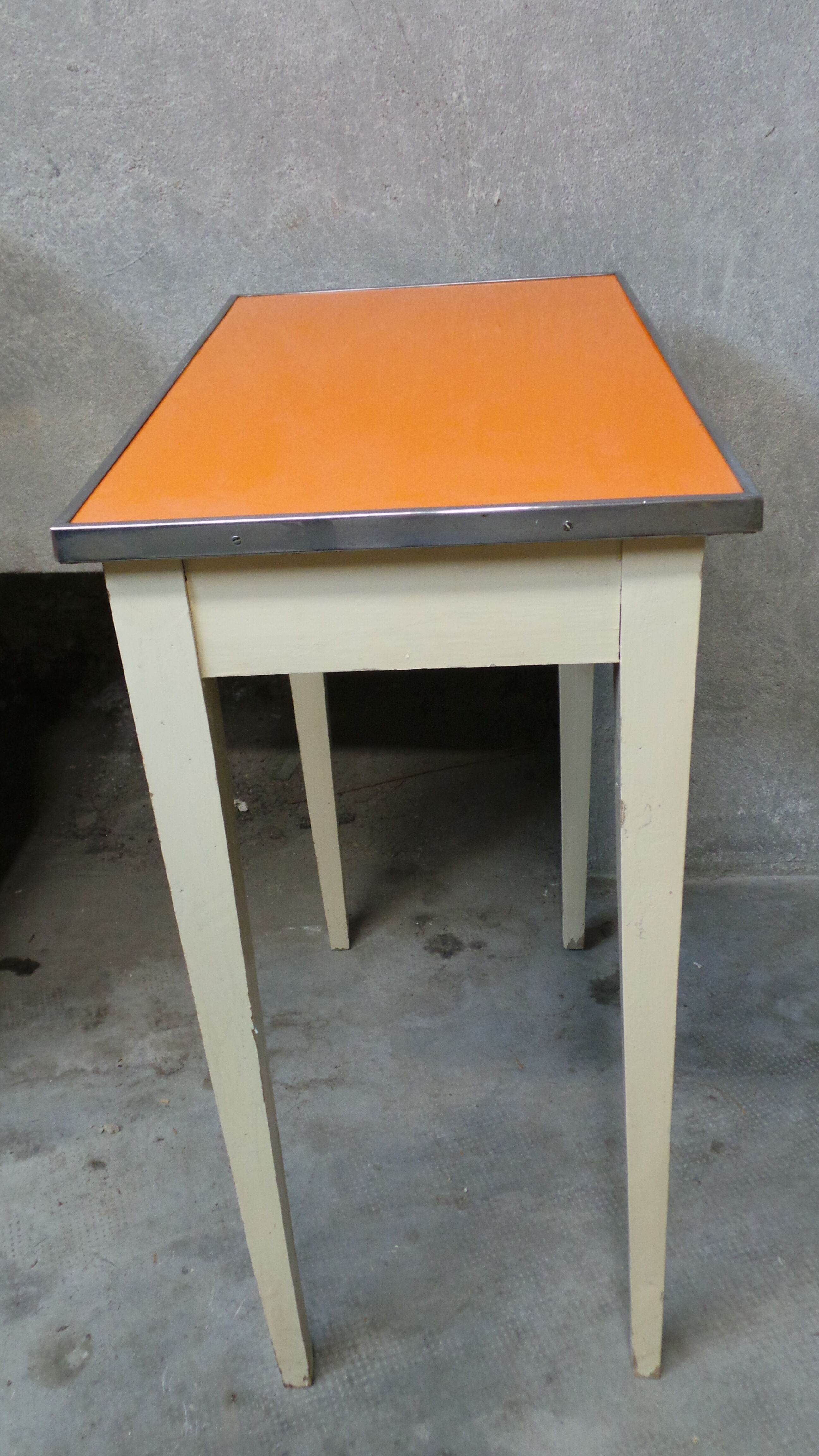 Orange wood and formica table