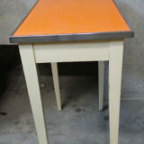 Orange wood and formica table