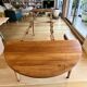 Extendable round table in solid walnut, 125cm in diameter, 5 extensions.