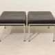 Pair of designer leather and brushed stainless steel footrests - Rob Parry