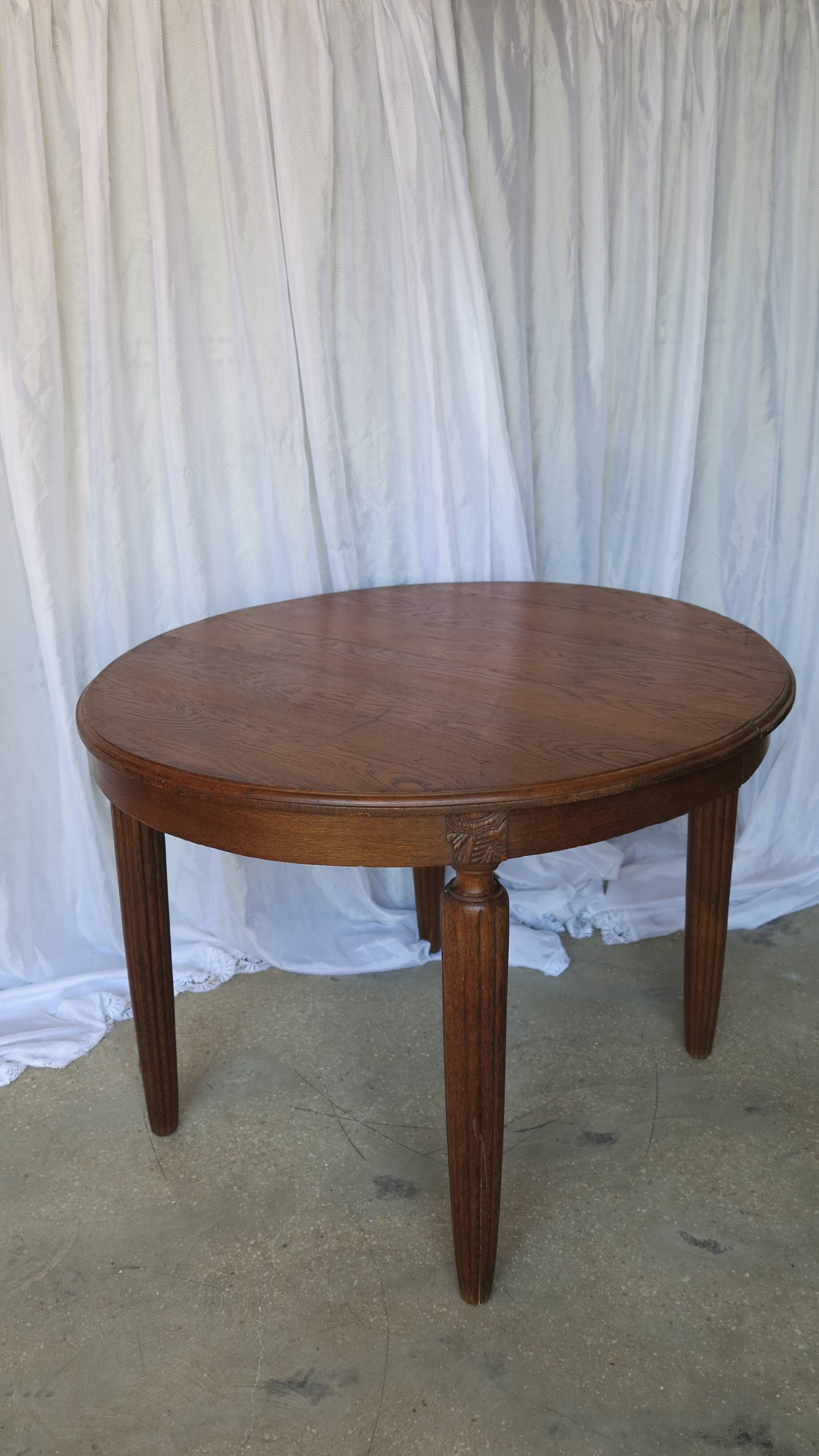 1930s oak dining table, slightly oval.