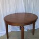 1930s oak dining table, slightly oval.