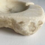 White marble ashtray with a raw appearance